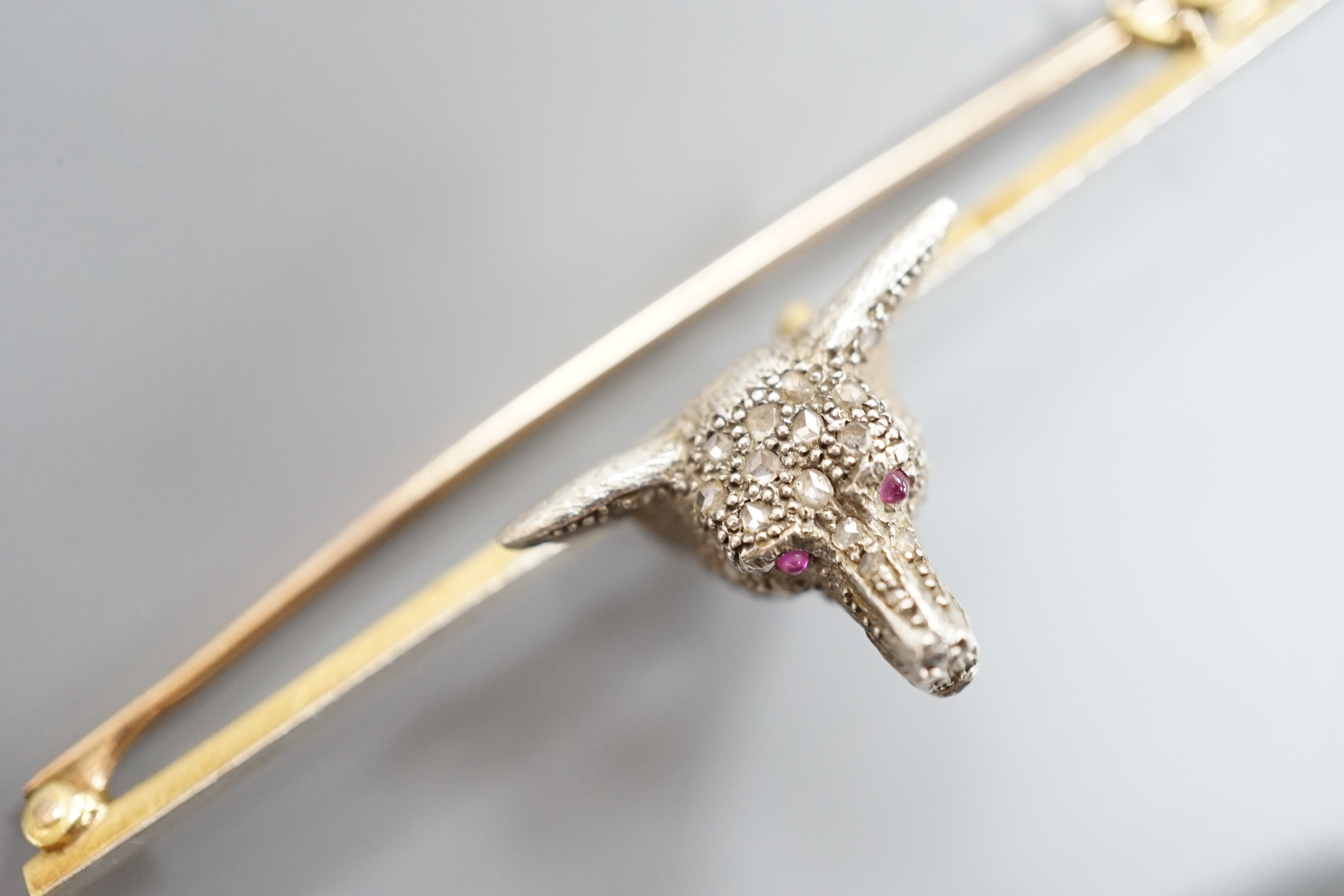 A yellow and white metal, rose cut diamond set fox head bar brooch, 62mm and a yellow metal, rose cut diamond and turquoise set bar brooch, gross weight 11.6 grams.